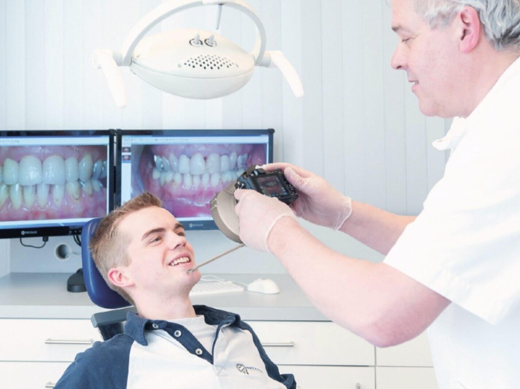 Orthodontist photographing a patient with the Sony Medical-D camera